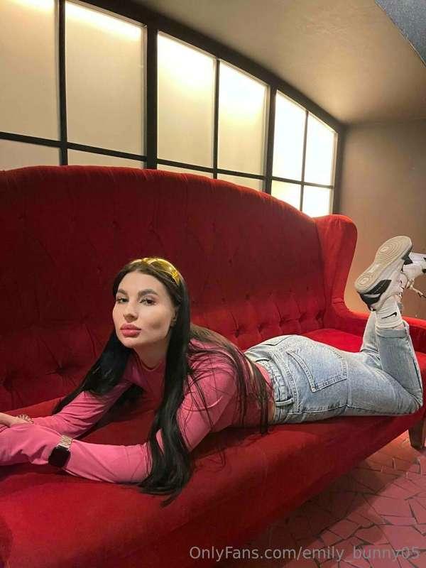 On the red couch, a sizzling Tigress crackles, its heat rele..