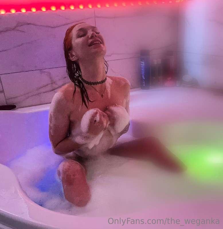 The warm water embraces me, and a playful smile spreads acro..