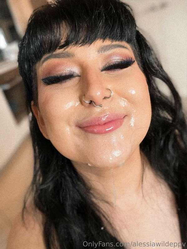 A happy girl with a face covered in cum and throat slime. 

..