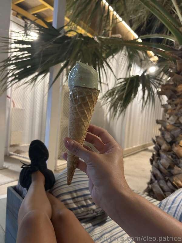 Enjoying a delicious green ice cream cone on a relaxing even..