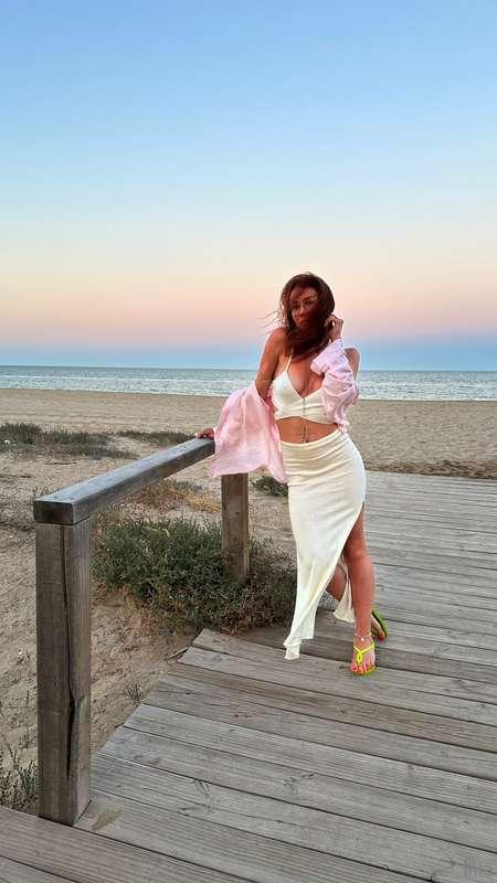 The sea breeze is teasing my dress... and maybe a bit of me ..