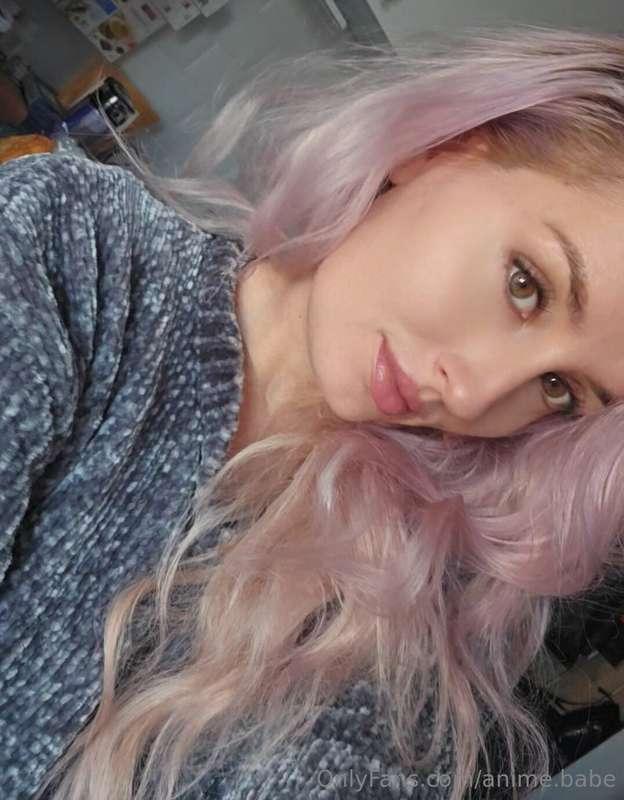 A girl with pink hair, a curious sight,Her photo shines in t..