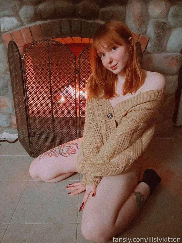 cozy kitty by the fireplace 🥰