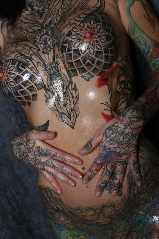 Oiled up tattooed tits and ass
