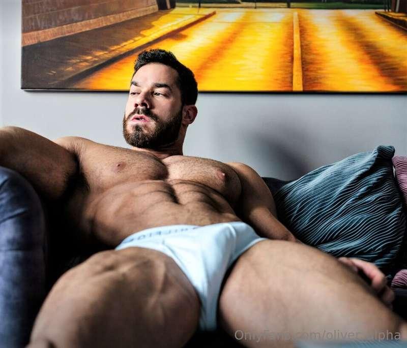 Chilling on the couch, abs tight, briefs stretched—tell me, ..