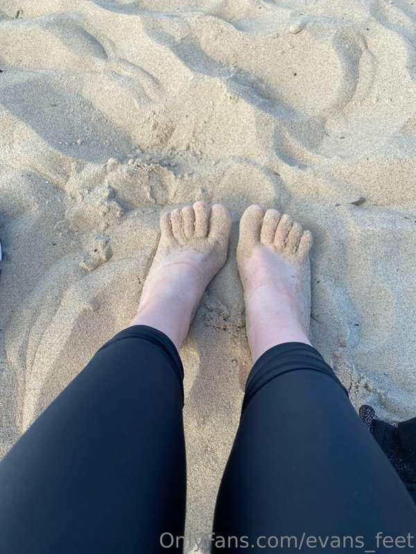 My legs are wet after the sea water and all the sand from th..