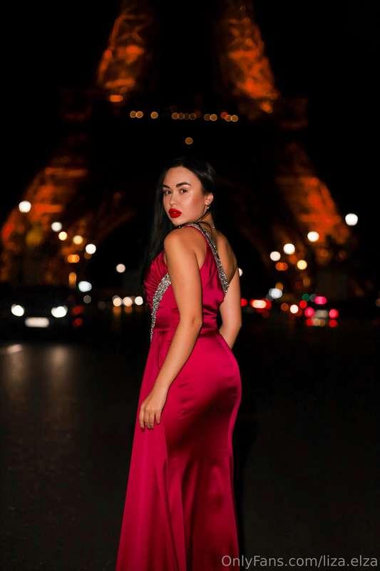 Who is this mysterious girl in a stunning red dress wanderin..