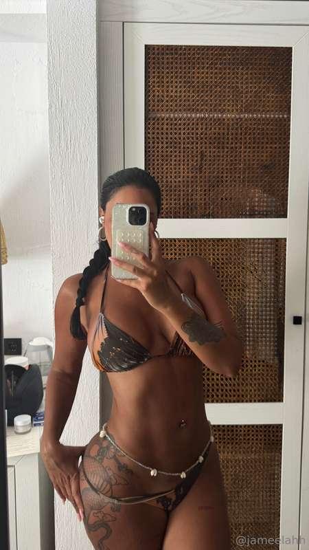 Tanned skin, sexy curves.