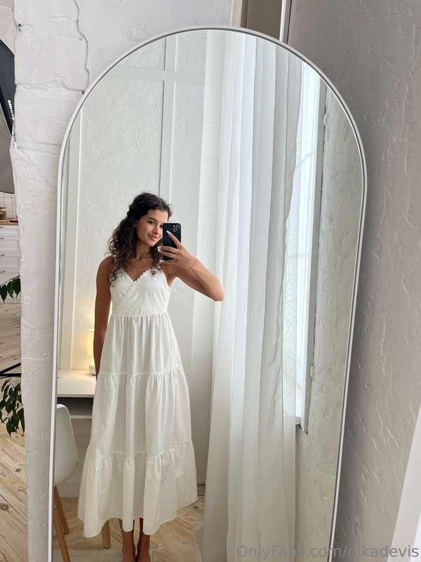 A white airy dress is a symbol of freshness, lightness and s..