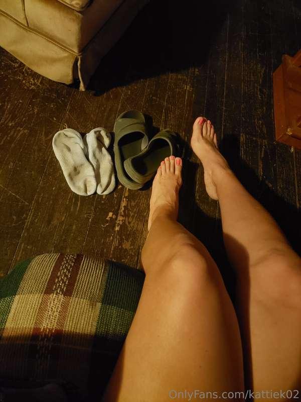 Candle lit feet, pink toe nails and wrinkly big soles. My vi..