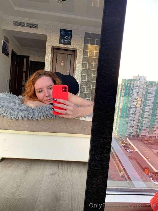 Bathed in the gentle light of dawn, she lays by the window, ..