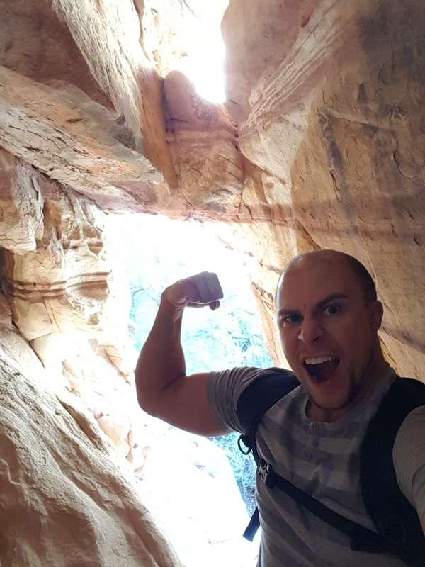 hiking at redrock national park. finding hidden caves to be ..