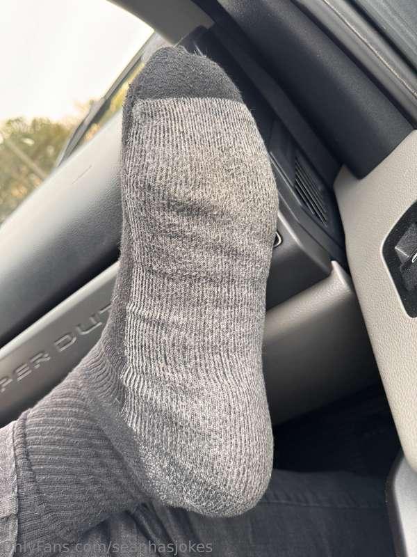 Big feet in a big car