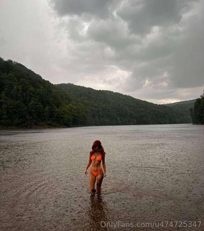 Warm raindrops glide across my skin, mingling with the joy o..