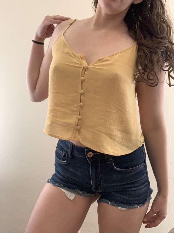 strip tease out of a tank top and short shorts 💛