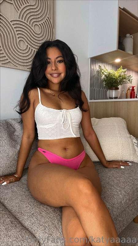Smiling sweet, sitting naughty—this little pink tease comes ..
