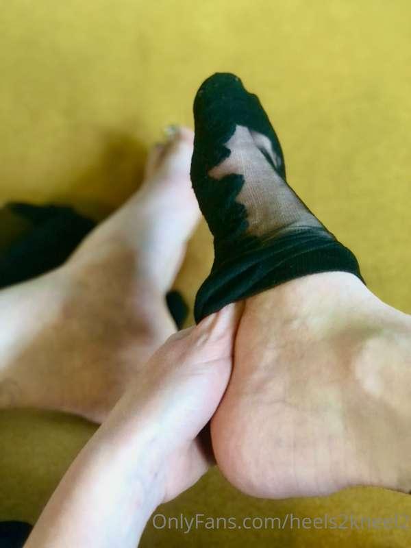 Silky embroidered black stocking socks come off: resting on ..