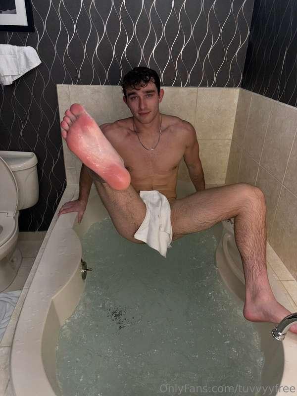 I slid my wet feet across the soft carpet in the tub and ins..