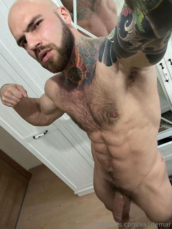 Strong biceps, steel abs, a thick beard, and a hefty presenc..