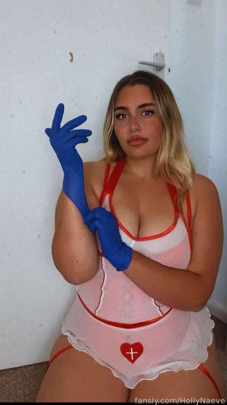 This naughty nurse has her latex gloves on ready 