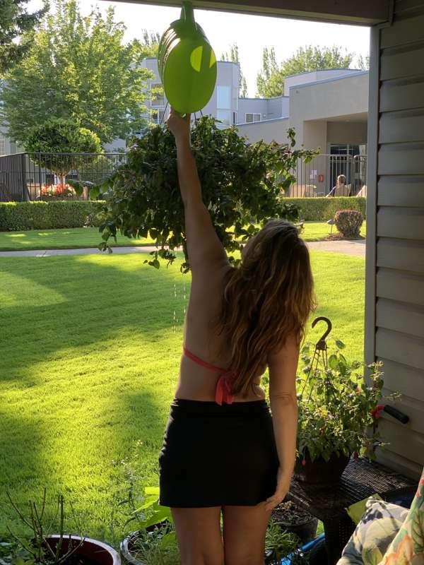 The cutest candid shot of me watering my garden 😅