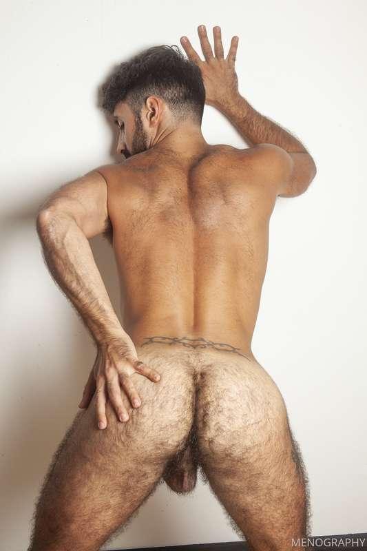 Jorge spreads his hairy butt to show me his hole