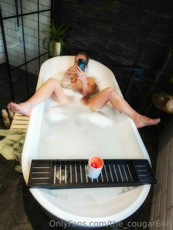 Multi tasking at its finest. Messaging fans, drinking wine……..