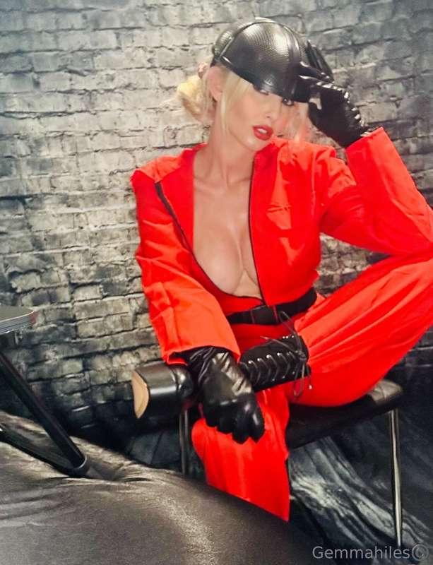 My red jumpsuit is tight, but not as tight as my throat wrap..