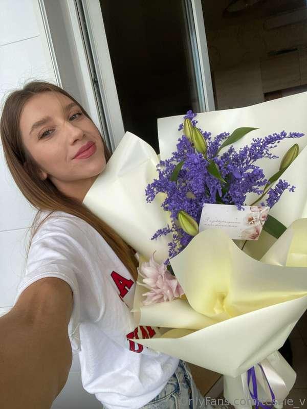 Adorned with nature's beauty, cradling a bouquet of joy and ..