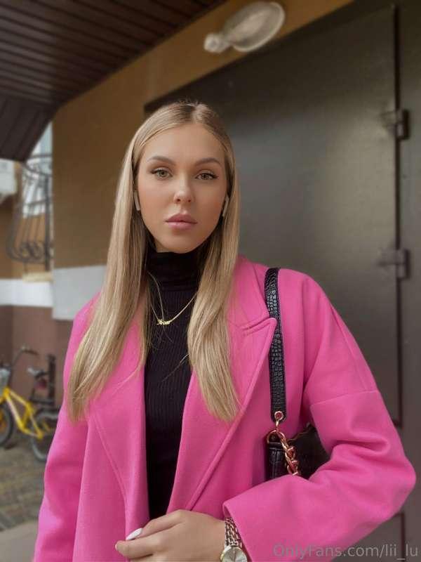 In the ethereal embrace of a blush-toned power suit, I embod..