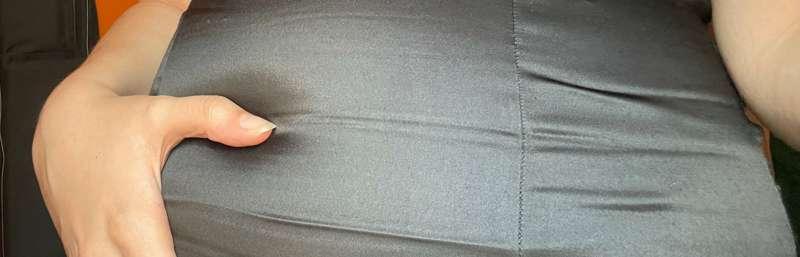 Feeling so huge in this tight shiny black dress… you can eve..