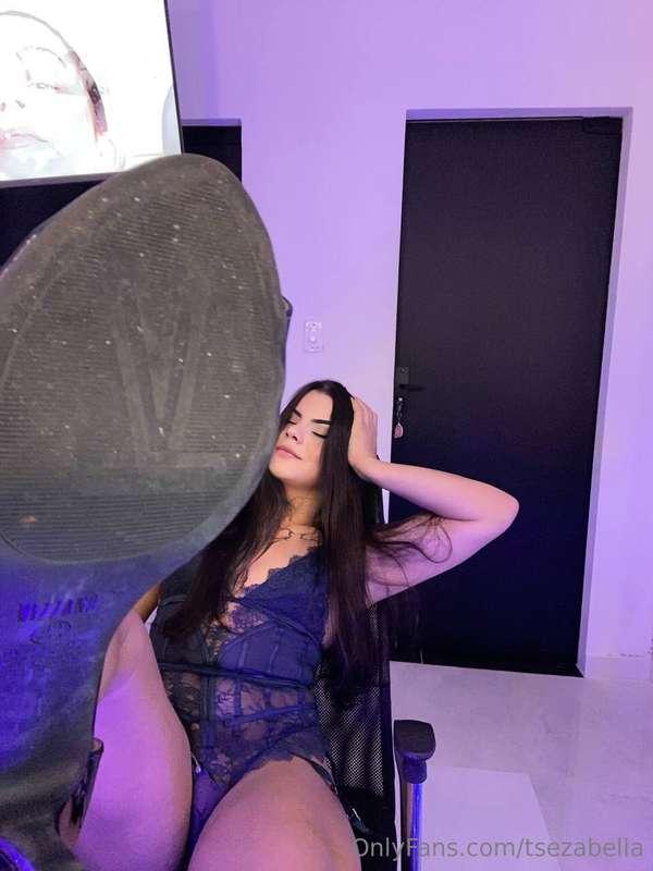 Laid back in black, heels up, eyes closed… I feel so small a..