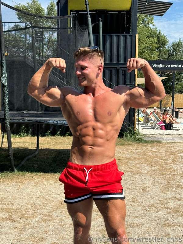 Flexing these biceps outside, shorts tight with a hard cock—..
