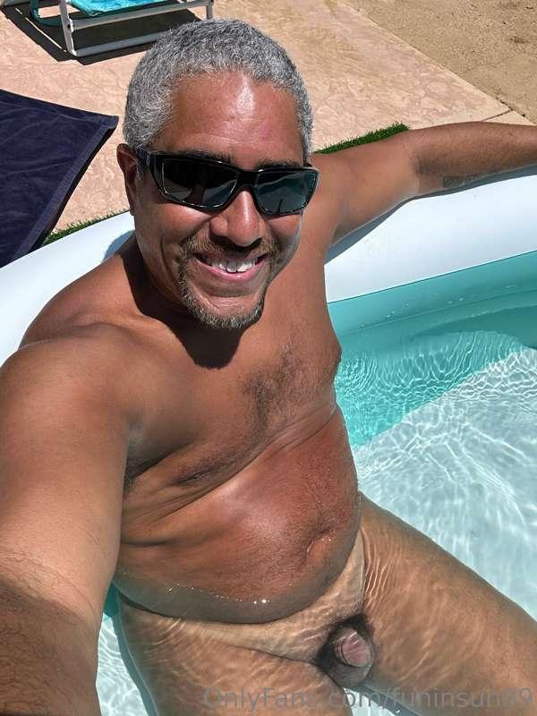 Taking a skinny dip in the pool during hot summer day.