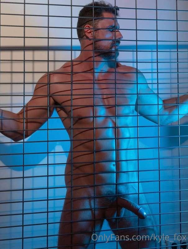 Pressed against the metal grid