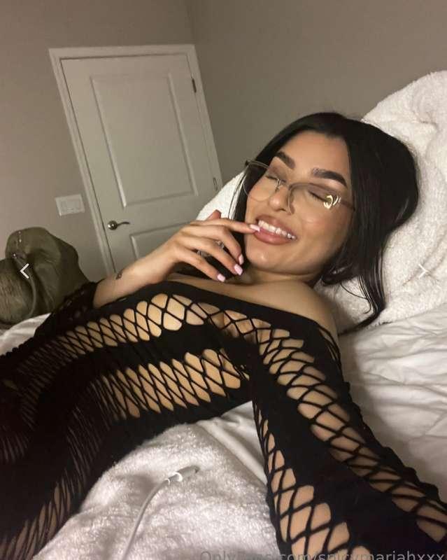 I’m lying back with my legs spread wide and my fingers circl..