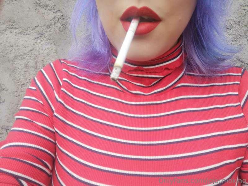 Purple hair, white stripes today and a matching cig. Picture..