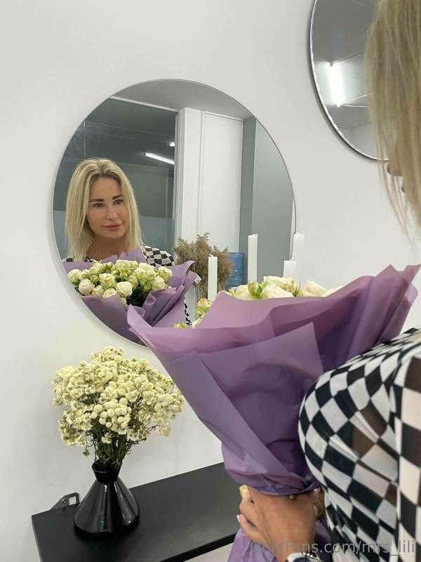 A happy woman not only from flowers but also from orgasms, a..