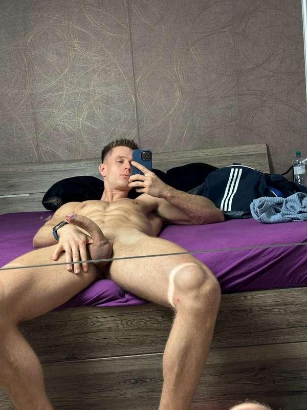 Laid out, fully bare, mirror catching every angle… no filter..