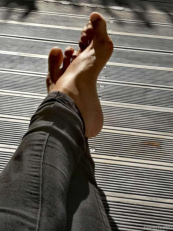 My feet are sticky after squashing some small oranges. I'm j..