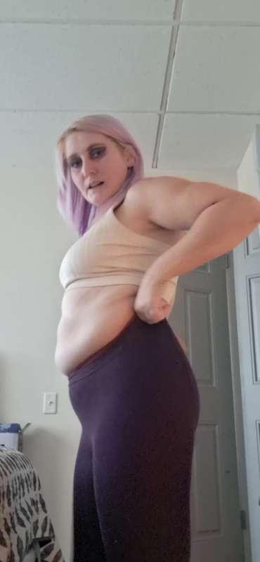 Taking off double layerd pantyhose purple on top of maroon colored pantyhose 