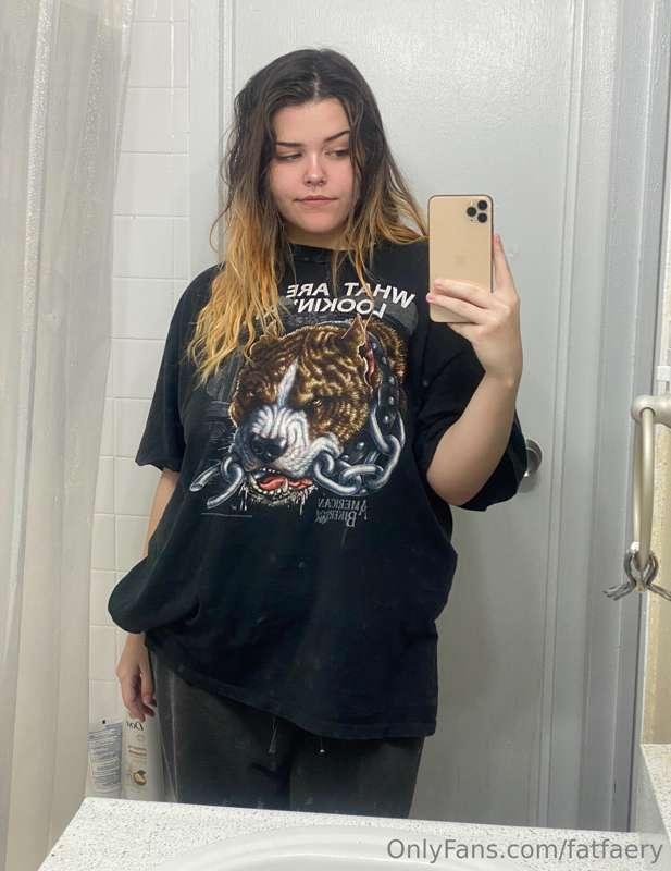 the face of a girl who has a belly ache & is being v brave a..