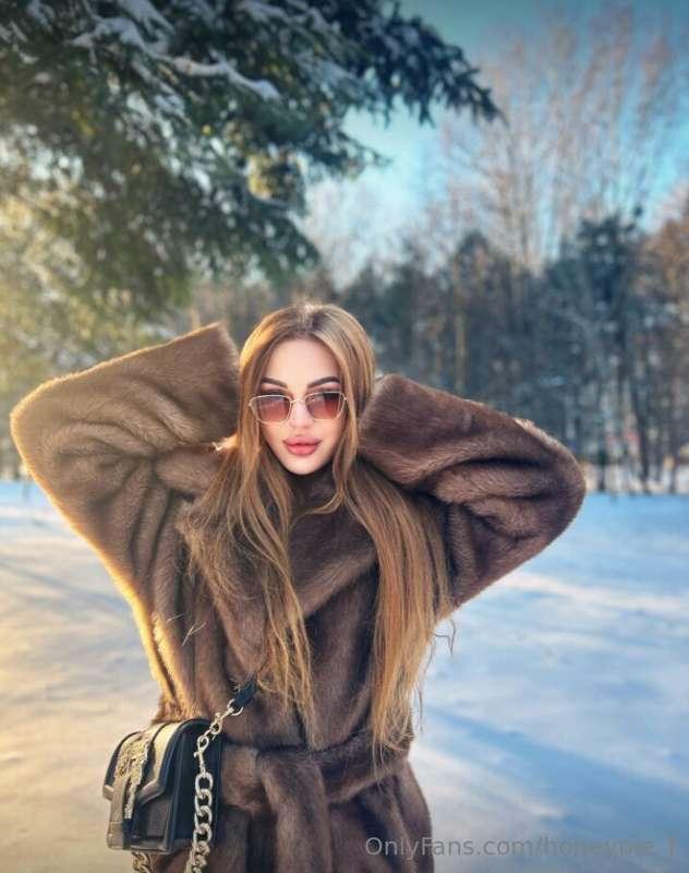 Snowflakes twirling around, I dance in the sunlight's warm e..