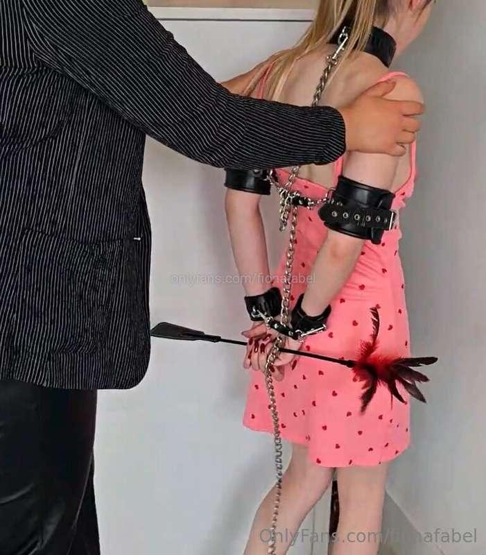 Looking pretty in her cute dress, completely chained to make..