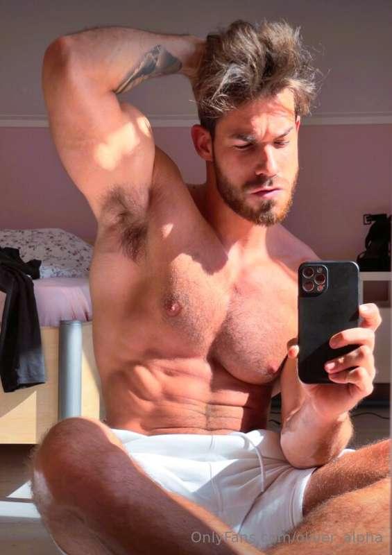 Sitting on the ground, sun kissing my skin, abs out, lowkey ..