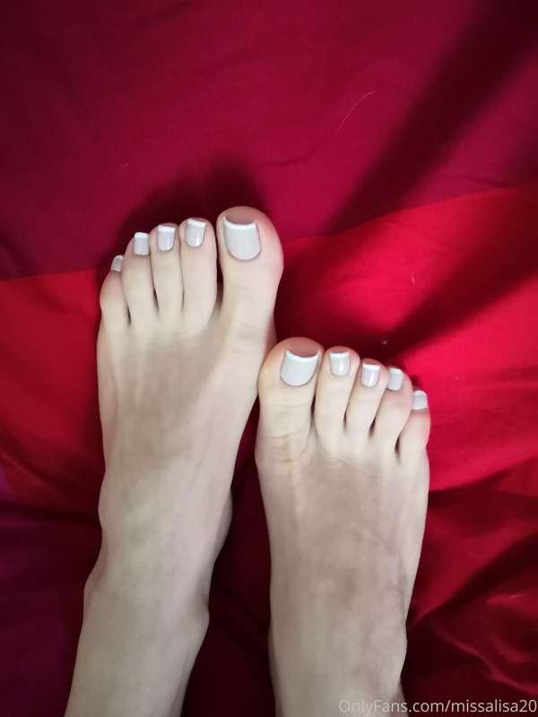 red bedsheet white toes