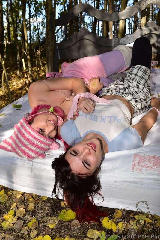 two girls on a bed in the woods... what are they gonna do to..