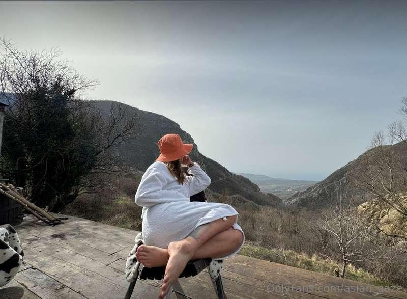 Amidst the majestic peaks, I stand in awe of nature's grande..