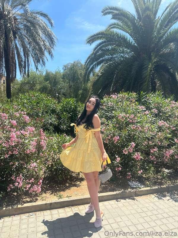 As I stroll through the garden, the gentle breeze teases my ..