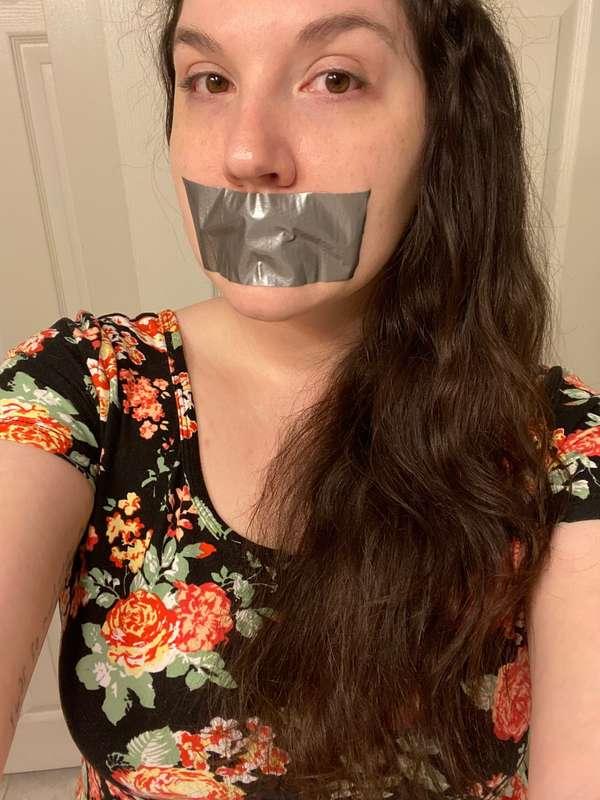 Don’t I look cute with a tape gag over my mouth?